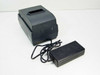 Epson TM-U200B Micros M119B dot matrix receipt printer – left-front view with external AC adapter power supply placed in front