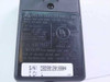 Rear label of Delta Electronics ADP-12EB showing model number, 100-120V 0.5A input, 12V 1A output, UL listing, and serial number sticker