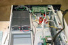 Liebert RT1000-60 UPS interior view — shows internal PCB, wiring, and four sealed lead-acid battery pack installed