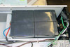 Liebert RT1000-60 UPS interior — closeup of four defective sealed lead-acid batteries in battery tray, top view
