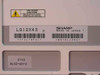 Sharp LQ12X43 rear label close-up showing model number, Made in Japan marking, and barcode serials