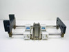 Thomson SSUPB16 linear guide — front end-on view clearly showing both parallel shafts, 4 white aluminum Super Smart pillow blocks with blue Thomson labels, and dark end support blocks