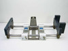 Thomson SSUPB16 linear guide assembly — rear end view showing dual shafts, 4 SSUPB16 pillow blocks with blue labels, central carriage plate, and end support blocks