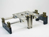 Thomson SSUPB16 Super Smart Pillow Block double end supported linear guide assembly — 3/4 angle view showing dual shafts, 4 pillow blocks, aluminum table top, and dark end supports