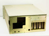 4U rackmount aluminum chassis – rear-left 3/4 view showing open rear I/O cutout, ventilation slots, and unpainted internal metalwork with no power supply installed