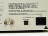 Panasonic WV-BM900 – rear panel close-up showing BNC Video IN and OUT, DC 12V IN barrel jack, IEC AC IN socket, and FCC compliance label