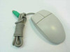 IBM Logitech M-S34 PS/2 two-button mouse – front and top view showing beige body, two buttons, and coiled gray cable with green PS/2 connector
