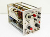 Tektronix Type 1L5 Spectrum Analyzer Plug-In Unit — three-quarter front view showing front panel controls, knobs, and open side revealing internal circuit boards
