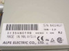 Alps Electric DF354N019B label closeup showing model number, DC5V 1.0A power rating, Made in Malaysia, CE/UL/CSA markings, and serial number