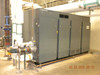 Atlas Copco ZH6-5 oil-free rotary screw air compressor — right-side view of full enclosure showing panel doors and large blue flanged pipe connection on left side