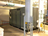 Atlas Copco ZH6-5 oil-free rotary screw air compressor — front-right view in mechanical room showing full enclosure with 'oil-free air' text visible and adjacent stainless piping