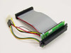 Exabyte 309724-002 SCSI Drive Carrier Cable assembly – angled top view showing 50-pin SCSI connectors, green PCB, flat ribbon cable, and Molex power connector with colored wires