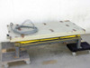 Scissor Lift Table SL35 in fully lowered position showing 60x30 cream-painted steel platform, yellow accordion bellows skirt, caster base, and coiled gray control cable on top