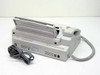 Sharp UX-300 plain paper fax machine rear view showing paper output tray open, power cord, and ventilation slots