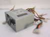 PC Power & Cooling Standard 250ATX 250W ATX power supply – three-quarter front view showing metal enclosure, dual fans, and full cable harness with Molex and Berg connectors