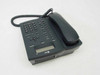 AT&T 955 corded desk phone – rear three-quarter view showing bottom panel and right side with handset in cradle