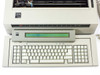 IBM 6770 Wheelwriter System/40 — close-up of keyboard and LCD display panel showing green display active, IBM branding on keyboard housing