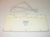 Dell AT101 GYUM97SK keyboard – bottom view showing full underside, label, and coiled PS/2 cable