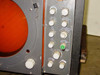 Close-up of Decca Radar TMS1230C display console right-side panel — multiple control knobs including tune, brilliance, range, and drive controls; green indicator lamp visible