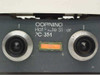 Corning PC-351 front panel close-up showing dual knurled control knobs (heat and stir), orange indicator light, and Hot Plate Stirrer model label
