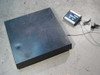Ohaus B250P floor platform scale shown with I5S digital indicator and power cable on concrete floor — full system view