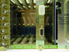 Sigma Electronics SS-2100-16 interior detail showing Control Buss card (2126) with DB9 connector and caution label