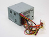 IBM API-7506 330W desktop power supply – rear and side view showing ventilation slots and output cable harness