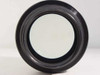 Front element of Nikon Printing-Nikkor 105mm f/2.8 lens showing clear glass in straight-on view