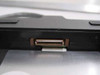 Compaq 258575-002 floppy drive caddy side view showing internal proprietary connector slot