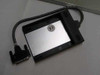 Compaq 258575-002 laptop floppy drive caddy bottom view showing CE mark and attached parallel cable