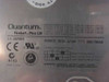 Quantum Fireball Plus LM bottom label showing brand name, 3.5 Series, power requirements 5V/12V 600/700mA, jumper configuration table, CE and UL markings, Made in Japan