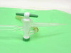 Close-up of Lab Crest FxP titrator stopcock assembly showing green-handled glass stopcock, white collar, and glass tip