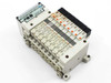 SMC EX120-SSH1 serial interface unit with VQ1100-5 solenoid valve manifold — angled front-left view showing EX120 controller module and full valve bank assembly