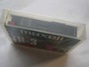Maxell TR-3 Travan Mini Cartridge side view showing cartridge mechanism inside clear plastic case