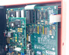 Kronos 460F interior close-up showing FK Modem PROM option board with ICs and ribbon cable connecting to Ethernet main board