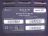 Belkin F5D8230-4 bottom label showing model F5D8230-4, version1001, Made in Taiwan, FCC ID SA3-AGN0901AP0100, WLAN/WAN/LAN MAC addresses, and regulatory markings