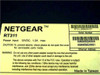 Netgear RT311 bottom label showing model RT311, power input 12VDC 1.2A max, FCC compliance, Made in Taiwan, serial number and dual Ethernet address barcodes