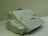 Sharp UX-510A plain paper fax machine — three-quarter front view showing handset, keypad, LCD display, and paper feed tray