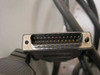 Close-up of DB25 male connector with gold-plated pins and metal housing