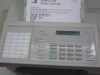 HP FAX-310 control panel close-up showing one-touch dial keys, LCD display with active text, numeric keypad, and function buttons