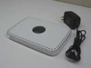 Netgear WPN824 v2 RangeMax wireless router — top view with power adapter included