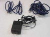 Included accessories for Netgear ME102: USB cable, RJ-45 Ethernet cable, and black AC power adapter