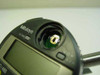 Mitutoyo ID-C112E with dial bezel removed showing internal encoder disc and PCB — battery compartment open for documentation