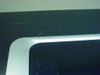 HP DeskJet 9800 top-left corner close-up showing surface scratches and scuffs on the black plastic housing