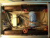 Interior view of MD10A controller box with top cover removed — four OMS MD10A Microstop drive modules, toroidal power transformer, large filter capacitor, and wiring harness visible