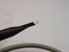 HP 10432A probe tip close-up — fine hook tip attached to black probe barrel