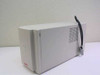 APC SU24XLBP battery pack enclosure right-side view showing ventilation grille and grey DC connector cable