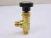 Nupro JN 1/4 inch brass metering valve — full body view showing black knob handle, hex body, and two compression ports