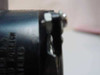 Microcomputer Power CP129 power supply – close-up of cracked fan housing showing damage to plastic fan case bracket