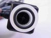 Omega FTB604 flow meter end-on view showing paddlewheel turbine rotor inside the clear flow tube
